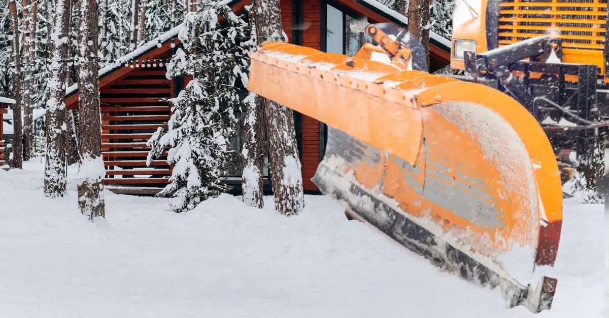 a snow plow in the snow, concept of Hiring a Snow Plowing Company Now to Prepare for Winter