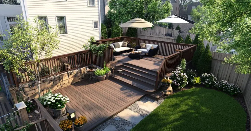 multi-level deck with umbrellas, seating and plants in small backyard