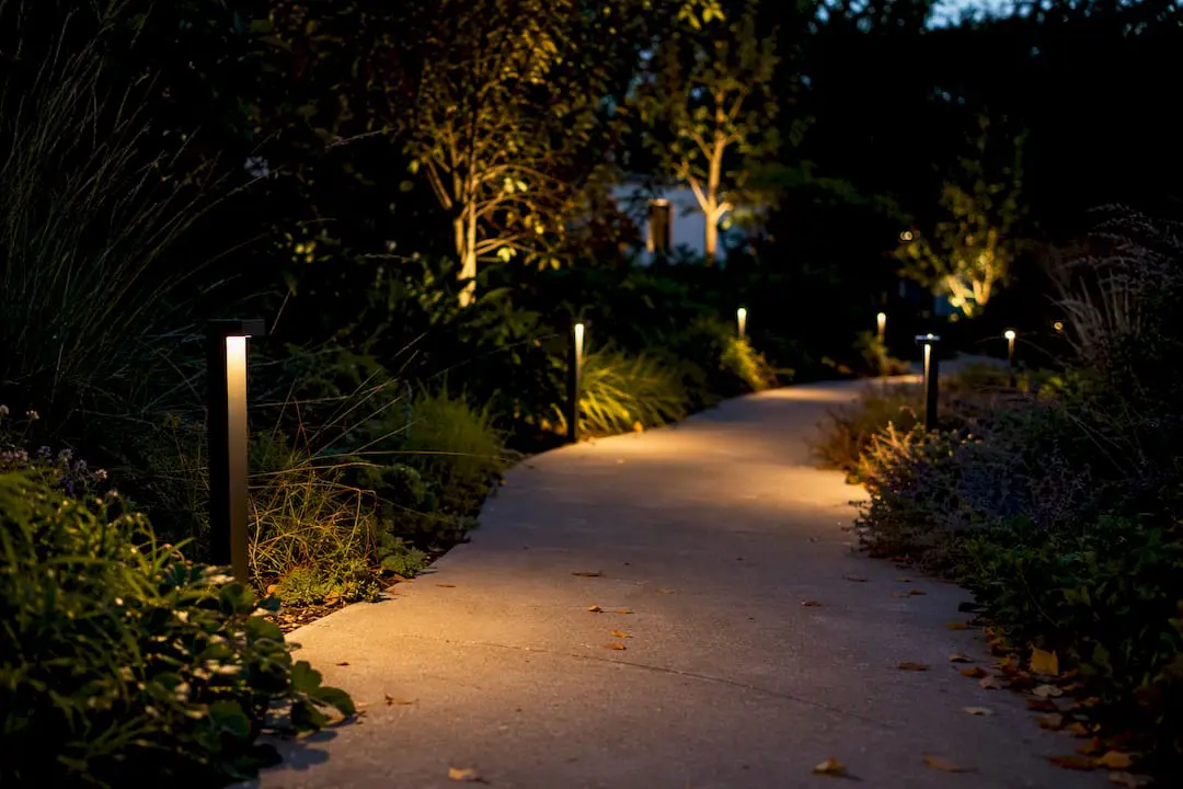 Warm path lights staggered on walkway