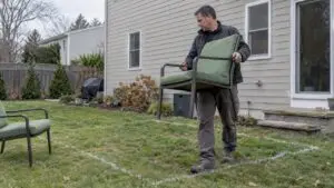 Homeowner testing a chalked patio footprint