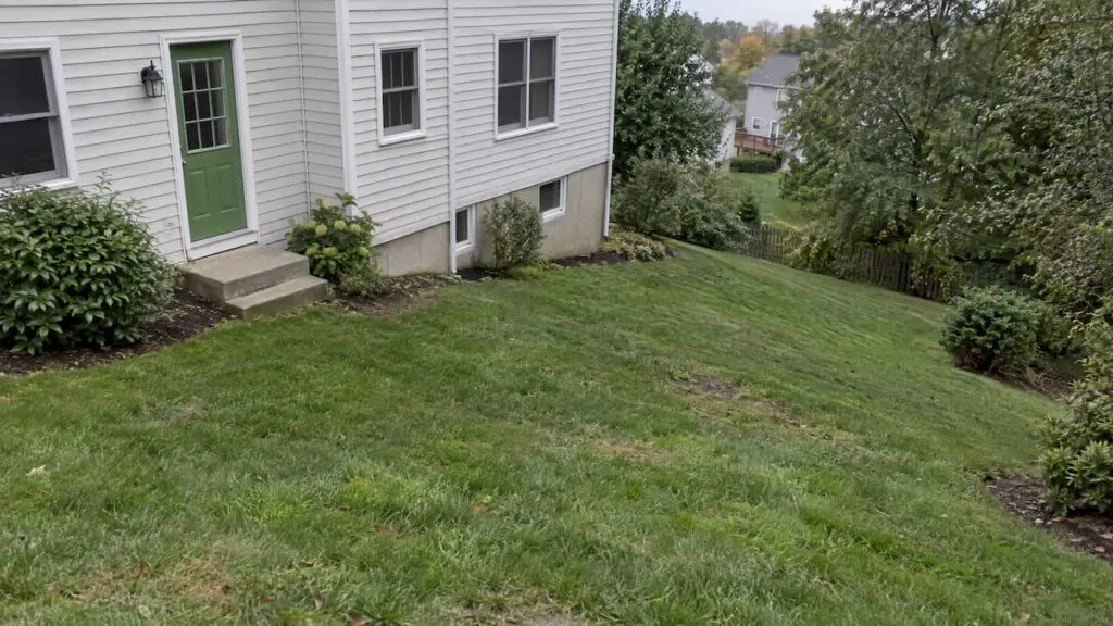 Sloping backyard beside a New Jersey home